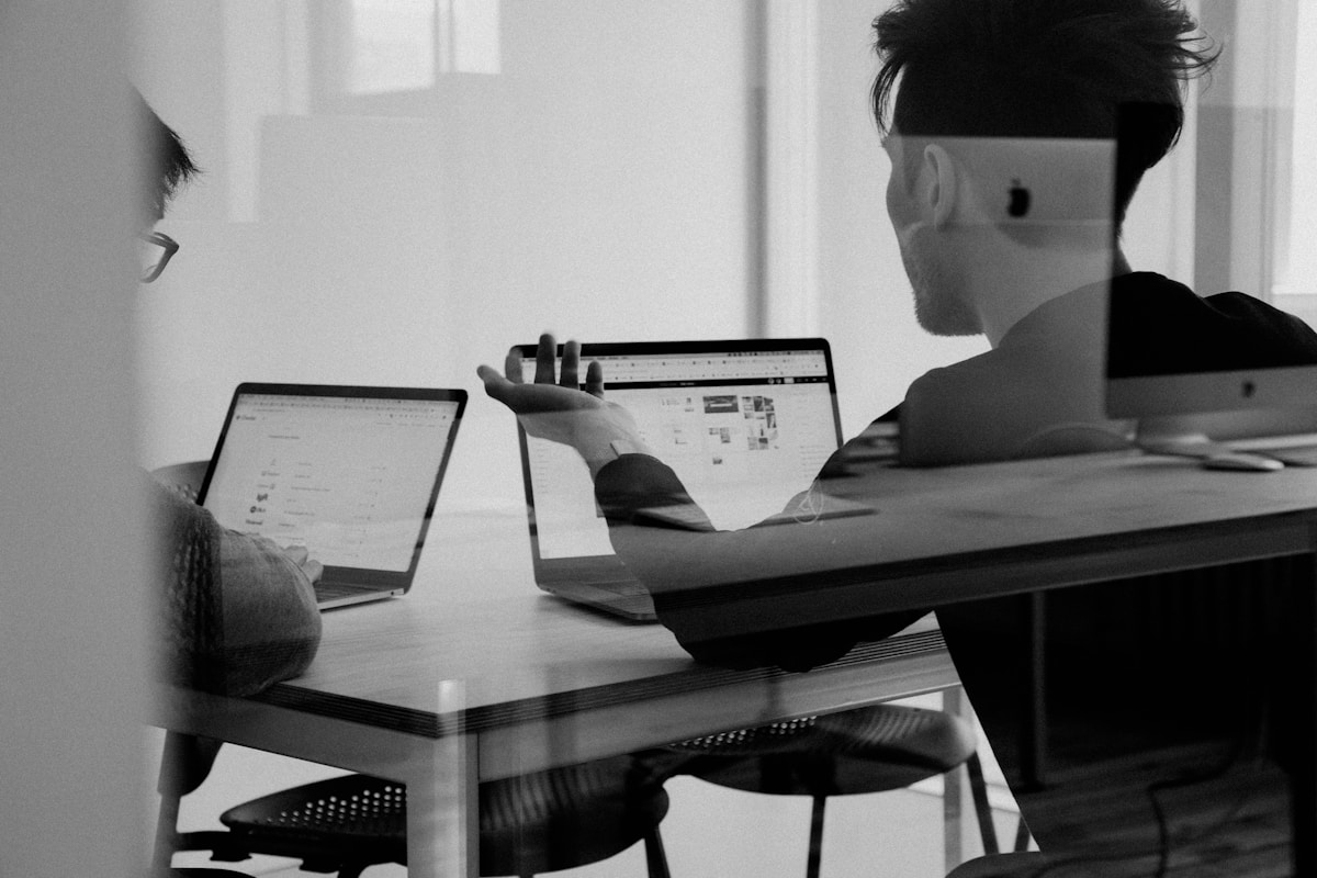 Data engineer reviewing pipeline diagrams at a workstation