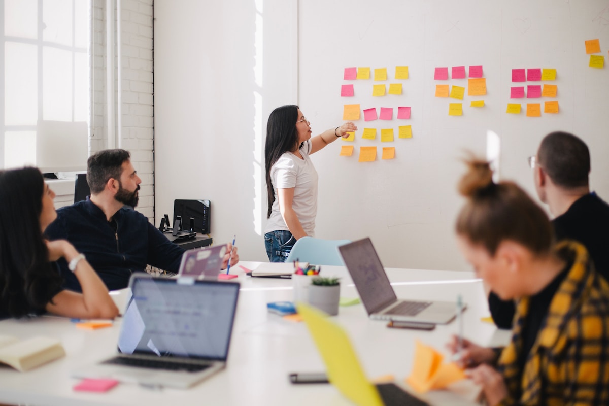 Engineers reviewing data pipeline architecture on a whiteboard